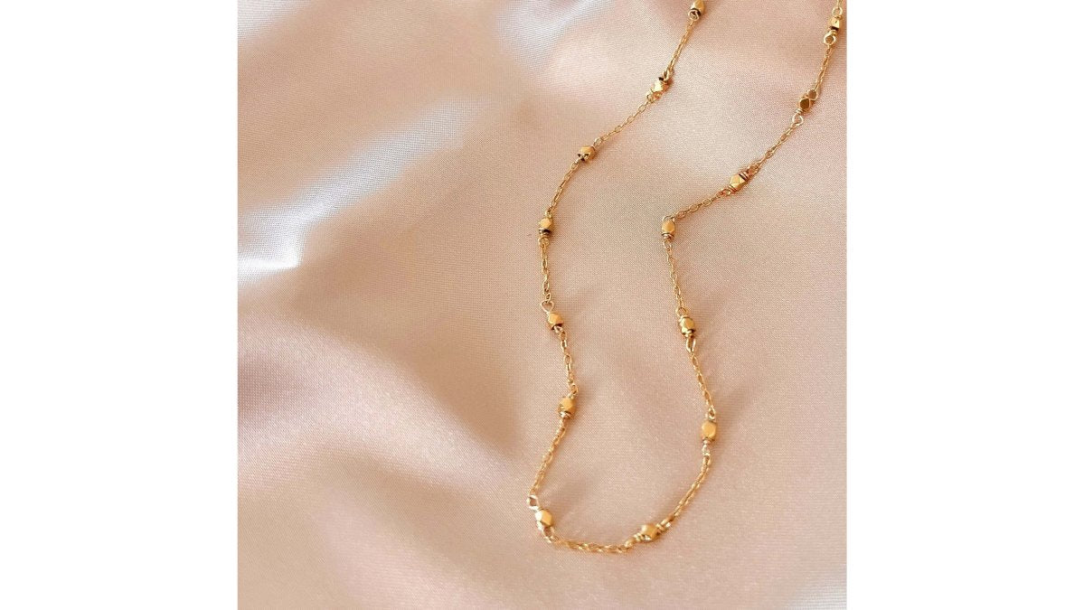 How to Layer Minimalist Necklaces Without Tangling