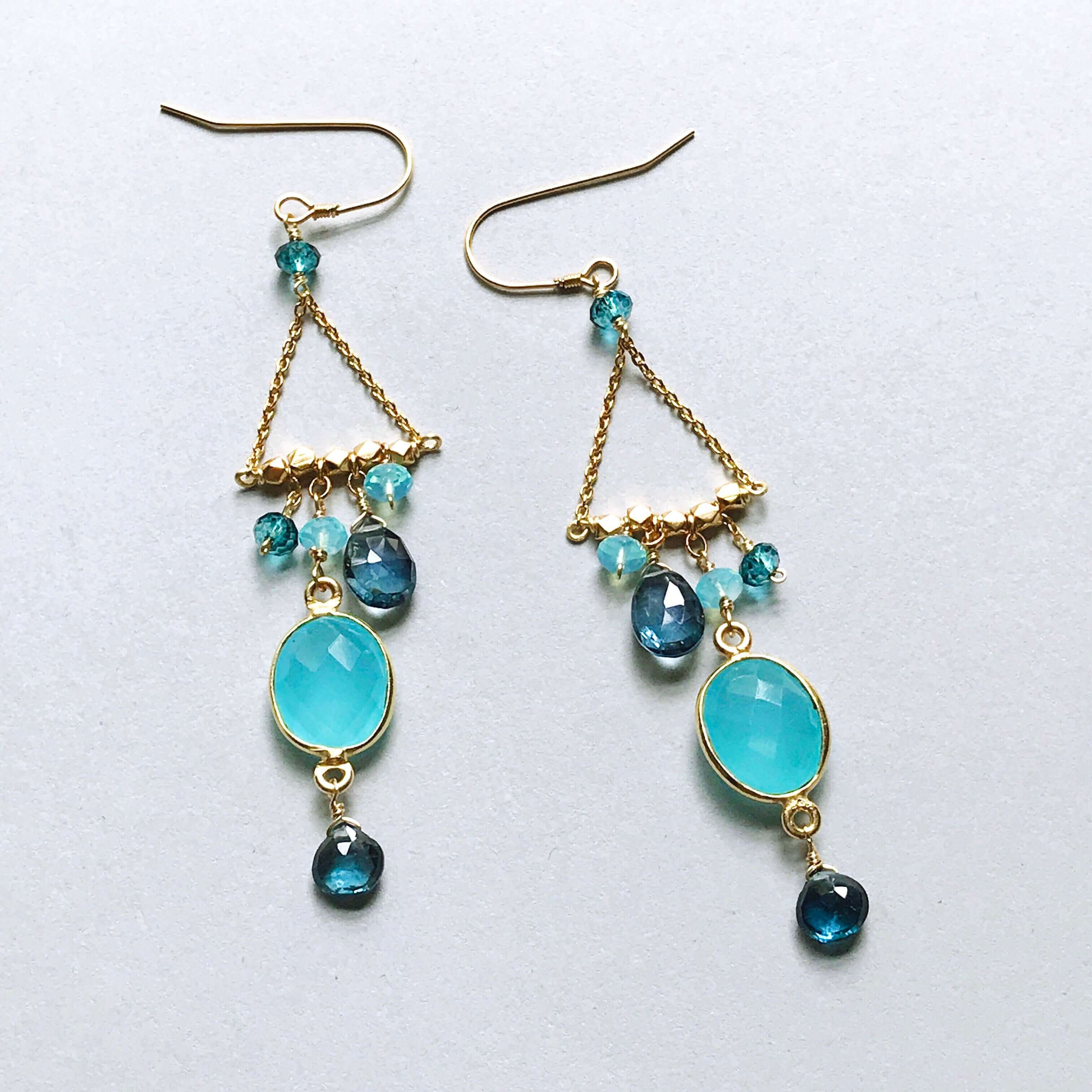 Bezel set blue chalcedony gemstones surrounded by faceted London Blue quartz accent stones Gold  Earrings 