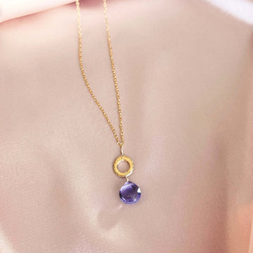 Layering chain with timeless amethyst gemstone. 14k gold plated .925 Italian silver, 16" length (extendable to 18"). Each stone unique, laid on a satin pink cloth.