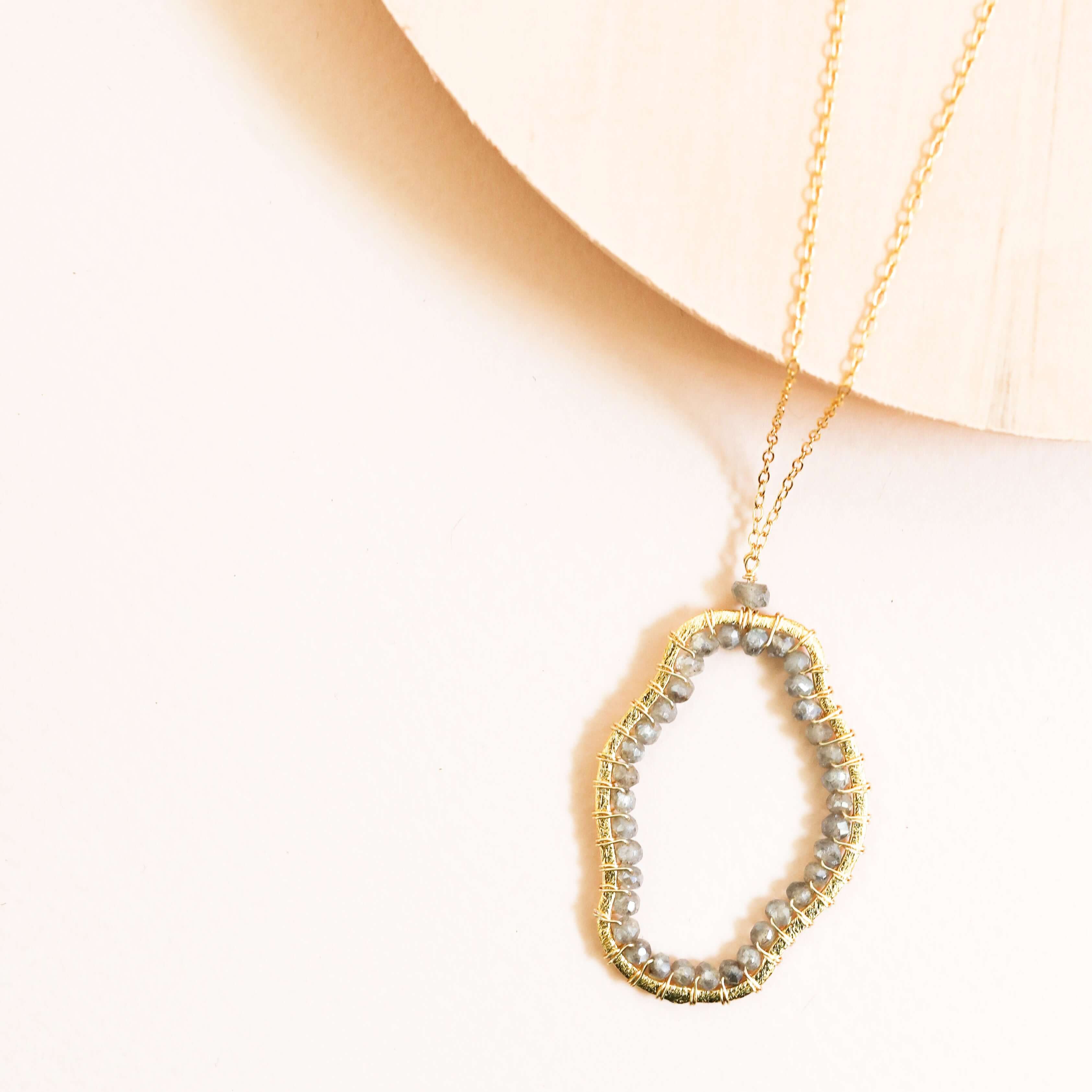 Floating Labradorite pendant delicately strung on an adjustable chain with a spring ring clasp
