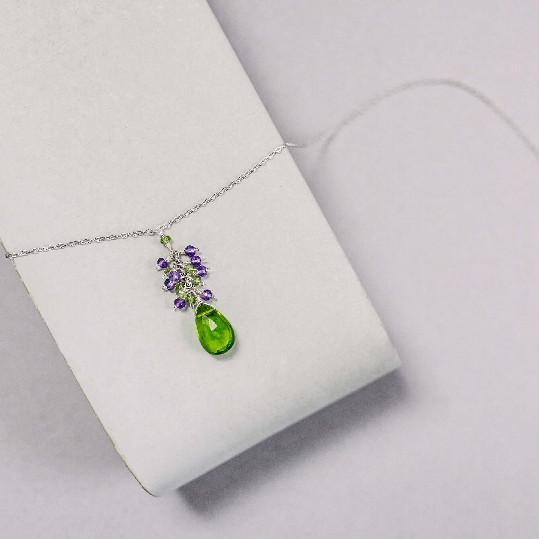 Rhodium plated  Necklace with a stunning Peridot  Quartz Pendant paired with Amethyst gemstones accent 