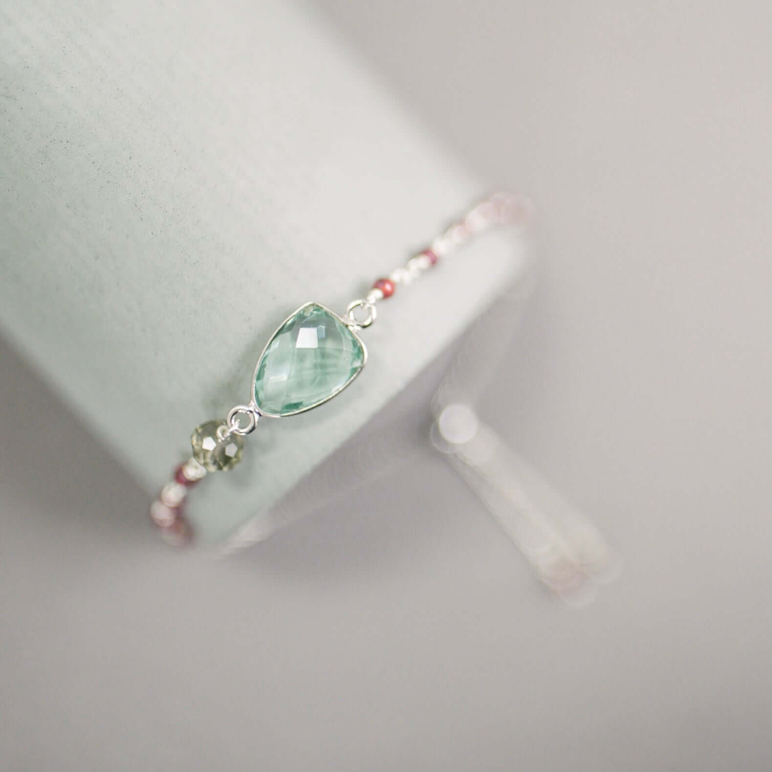 Rhodium plated Adjustable Bracelet with Green Amethyst Bezel and Tiny Gemstone Accents.