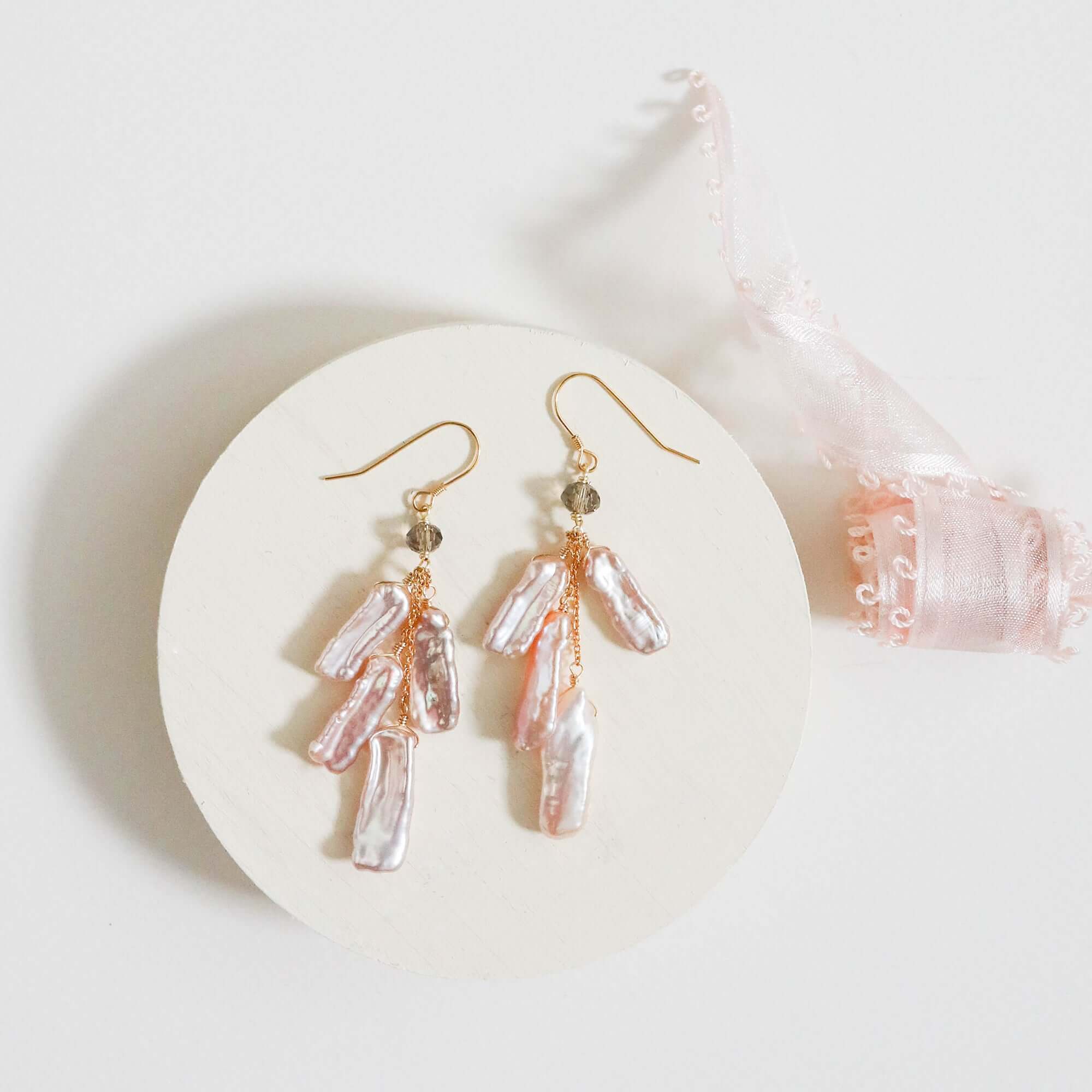 Blush Pearl Dangle in a Gold Earrings 