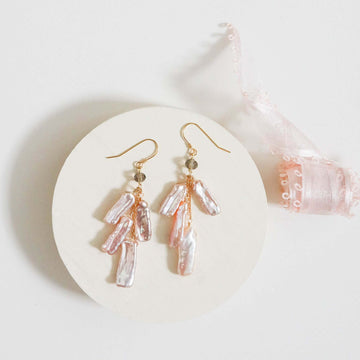 Blush Pearl Dangle in a Gold Earrings 
