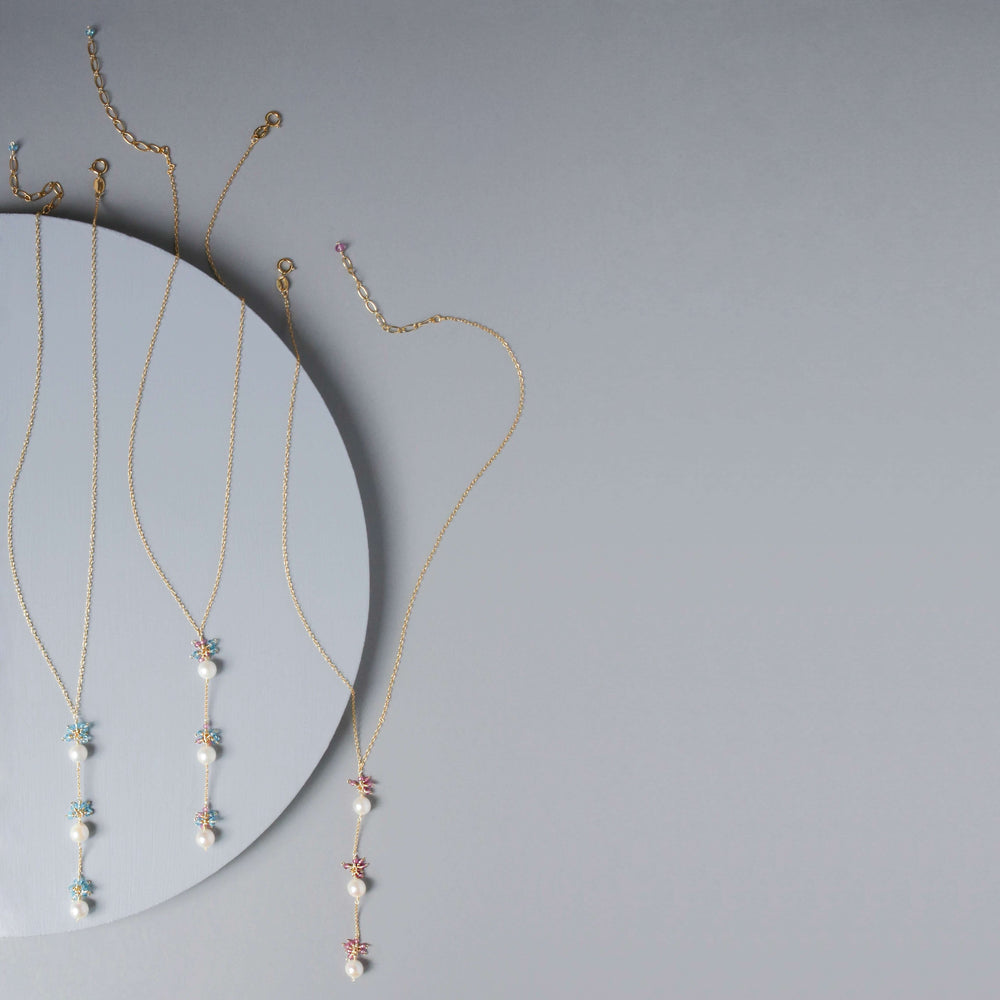 Colorful Gold plated Necklace with 3 white freshwater bead pearls paired with genuine rose quartz and aquamarine quartz gemstones
