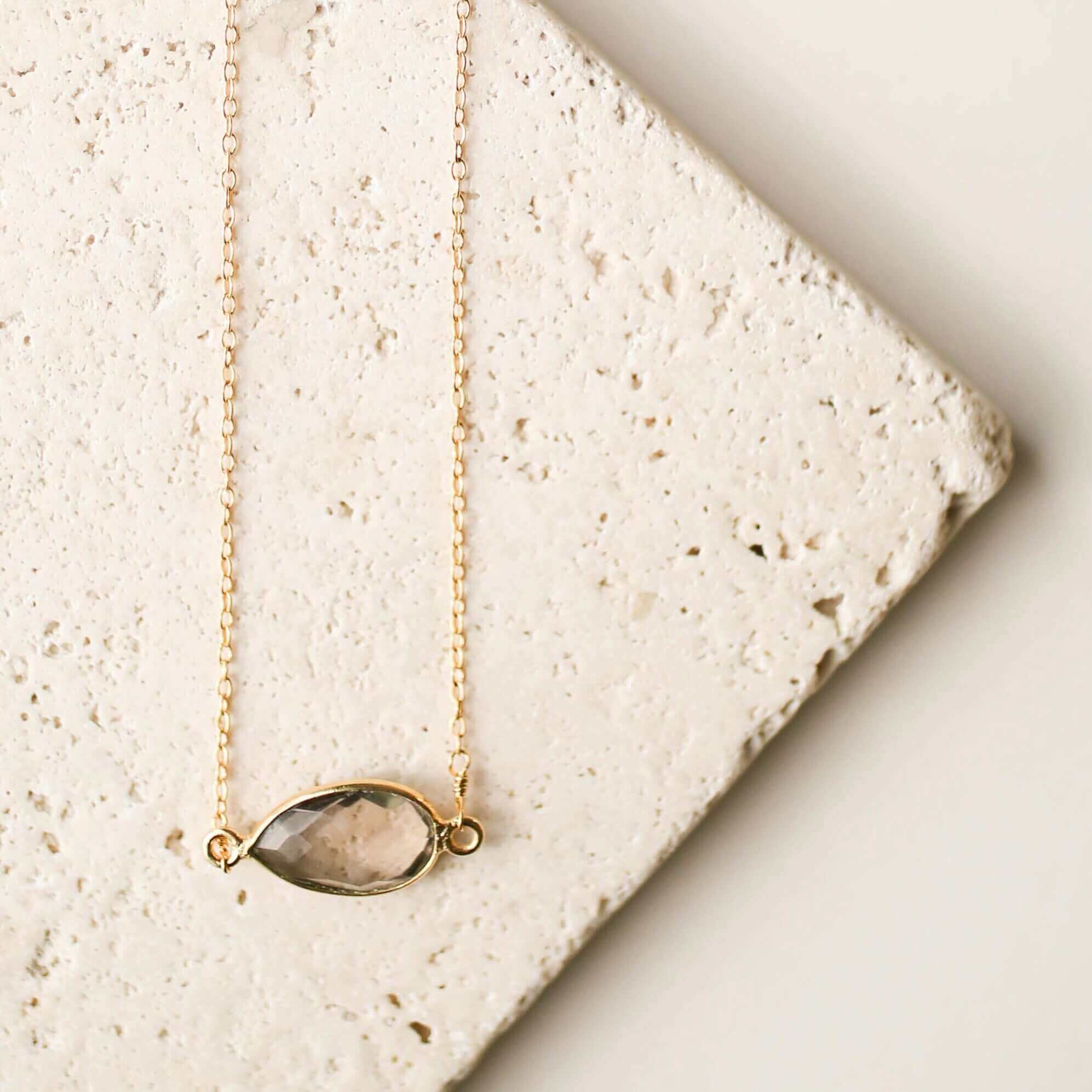 Gold minimalist necklace with a beautiful smoky quartz bezel set stone
