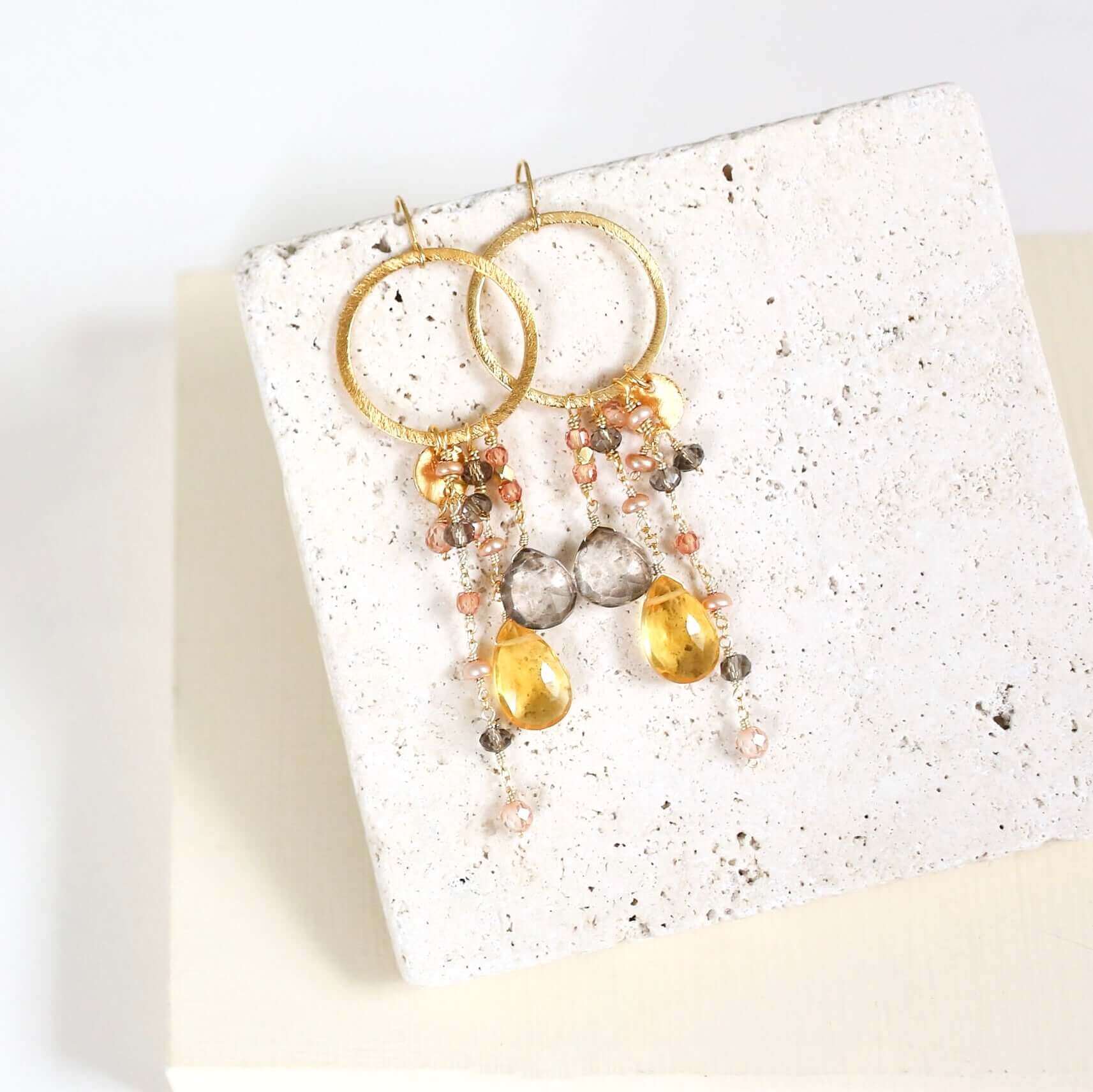 Multiple strands of lush gems sparkle on a hoop with Citrine Gemstone Dangle Gold Earrings