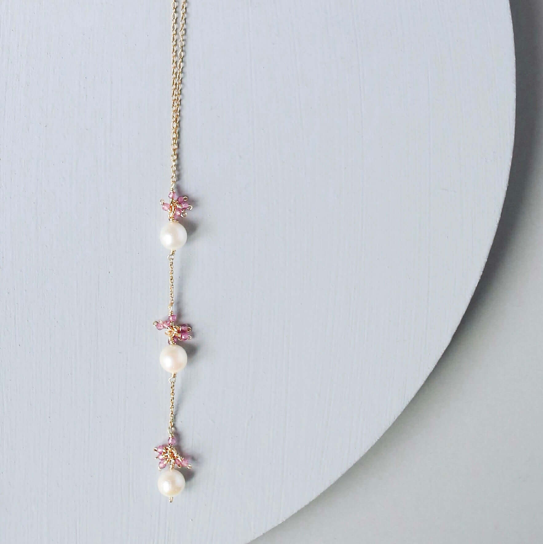 Gold plated Necklace with 3 white freshwater bead pearls paired with genuine rose quartz gemstones