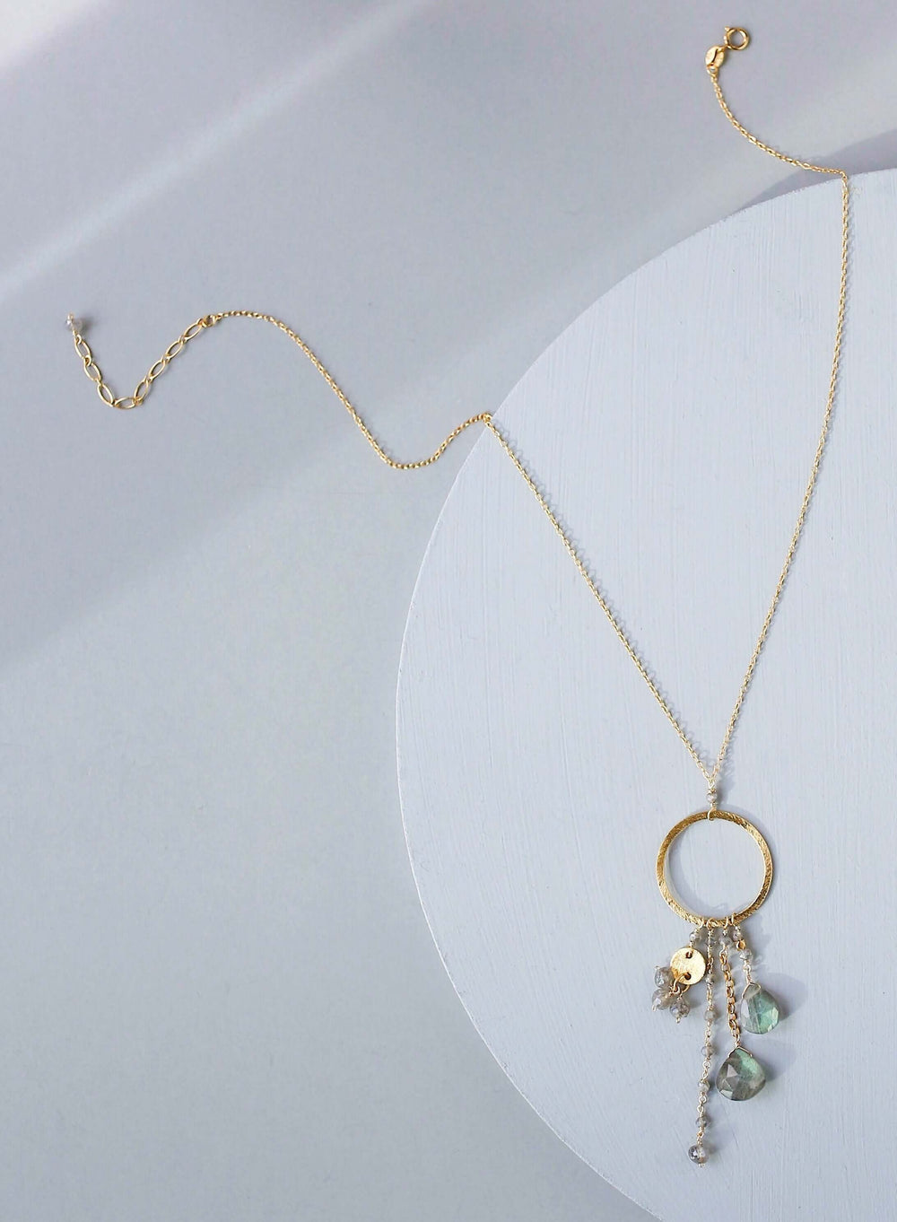 Multiple strands of lush gems sparkle on a hoop with labradorite gemstone Pendant Gold Necklace