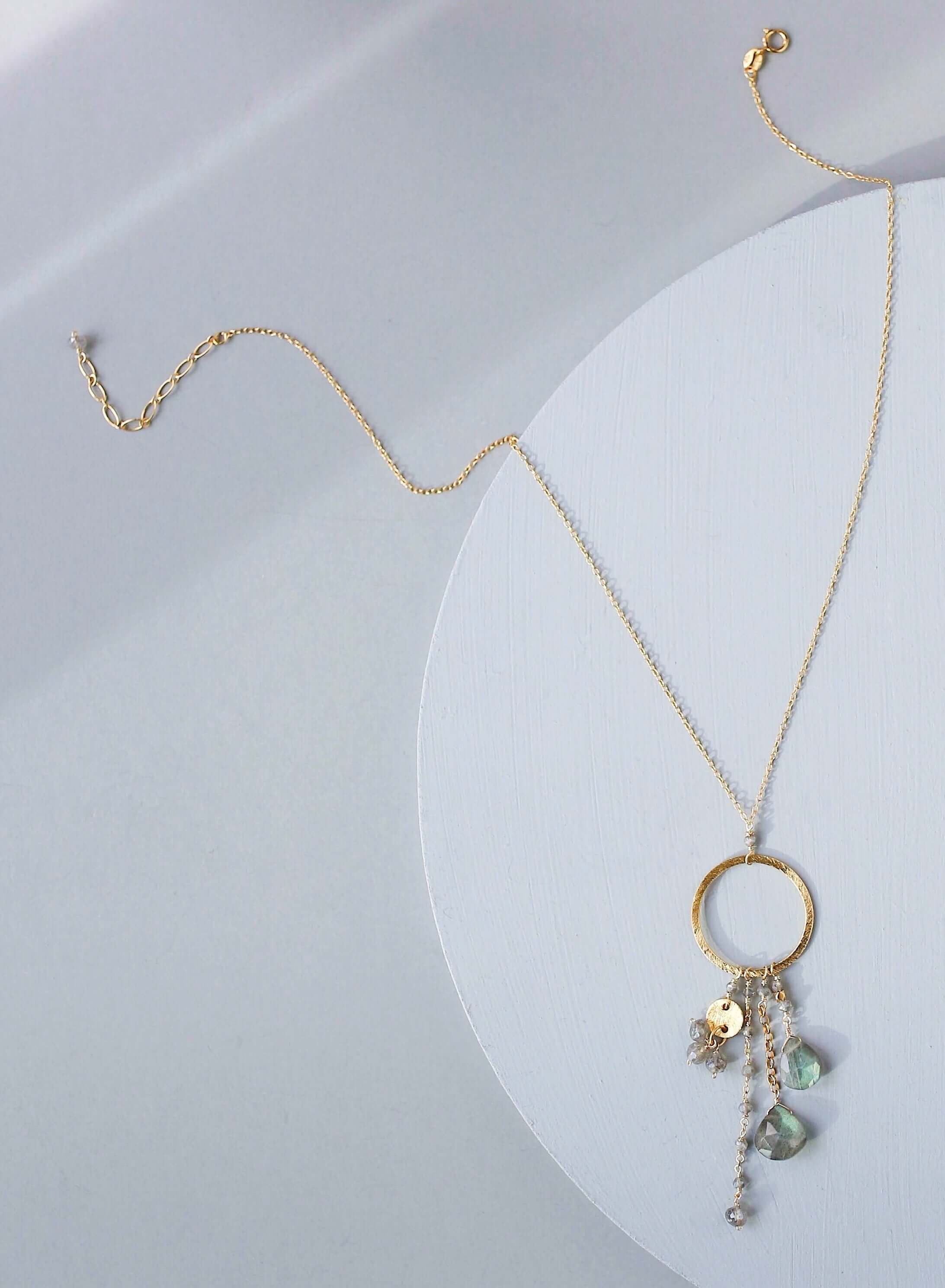 Multiple strands of lush gems sparkle on a hoop with labradorite gemstone Pendant Gold Necklace
