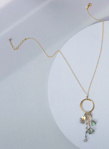 Multiple strands of lush gems sparkle on a hoop with labradorite gemstone Pendant Gold Necklace