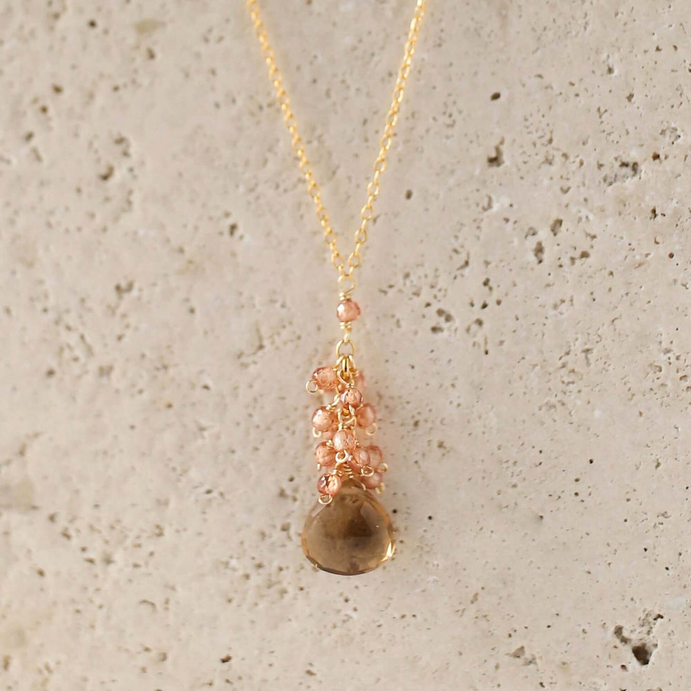 Smoky quartz "raindrop" pendants paired with a cluster of mini champagne quartz gems Gold Necklace