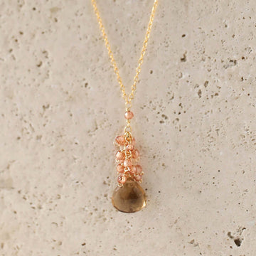Smoky quartz "raindrop" pendants paired with a cluster of mini champagne quartz gems Gold Necklace