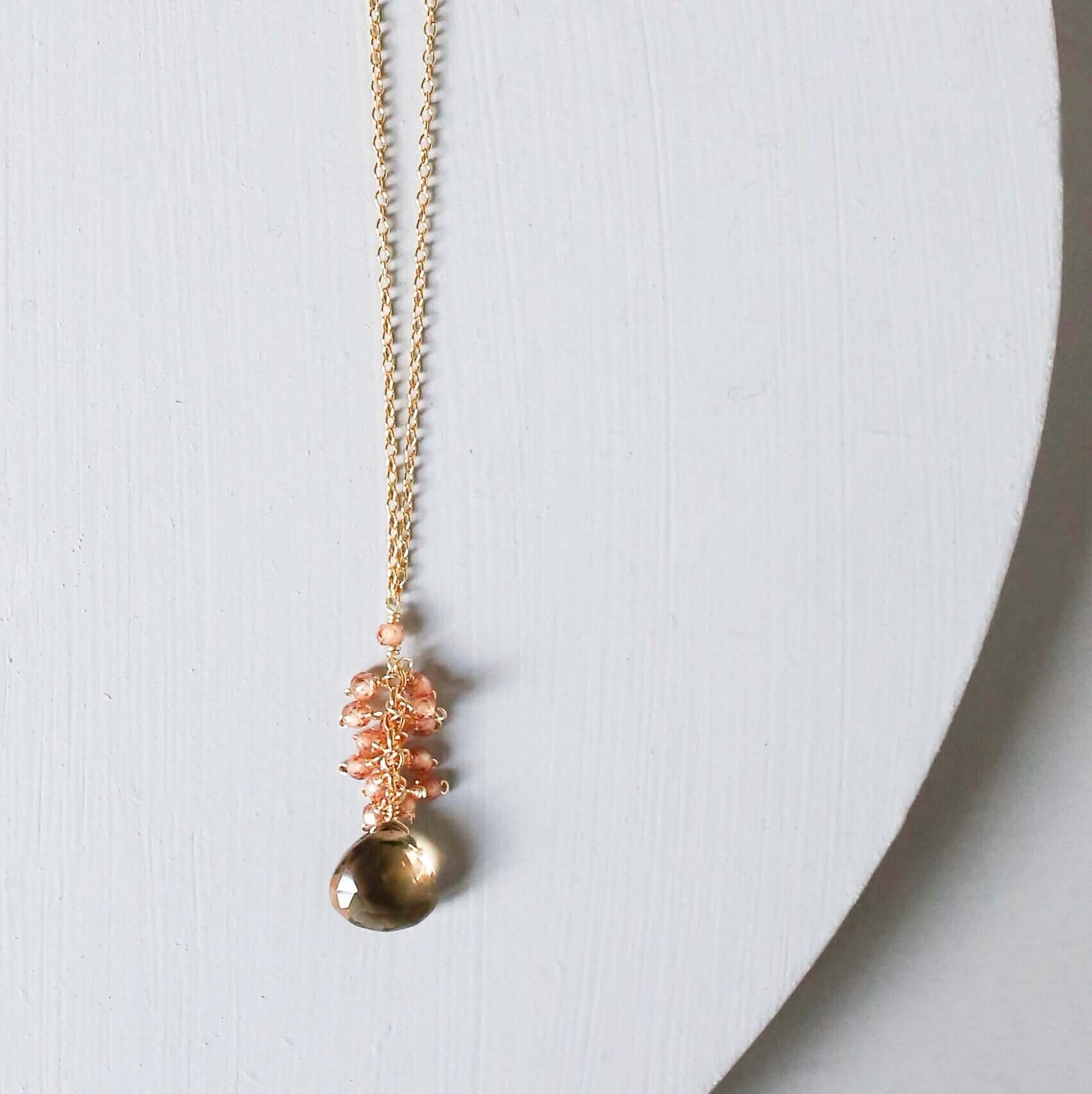 Smoky quartz "raindrop" pendants paired with a cluster of mini champagne quartz gems Gold Necklace
