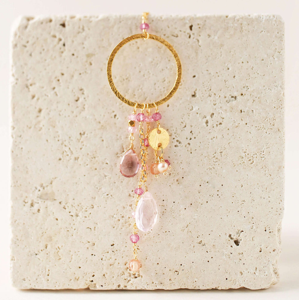 Multiple strands of lush gems sparkle on a hoop with rose quartz and pink tourmaline  gemstone Pendant Gold Necklace