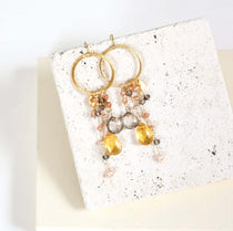 Multiple strands of lush gems sparkle on a hoop with Citrine Gemstone Dangle Gold Earrings