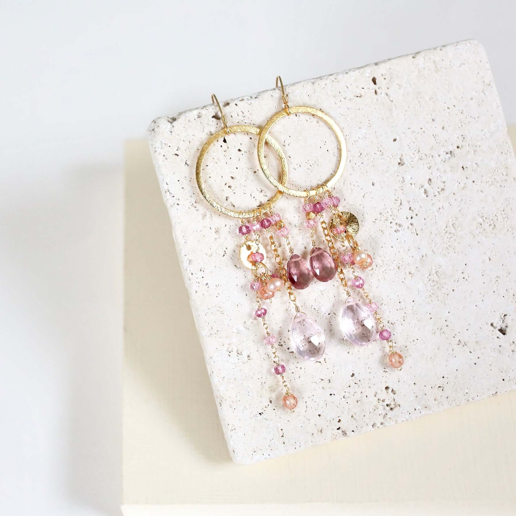 Multiple strands of lush gems sparkle on a hoop with Pink Gemstone Dangle Gold Earrings