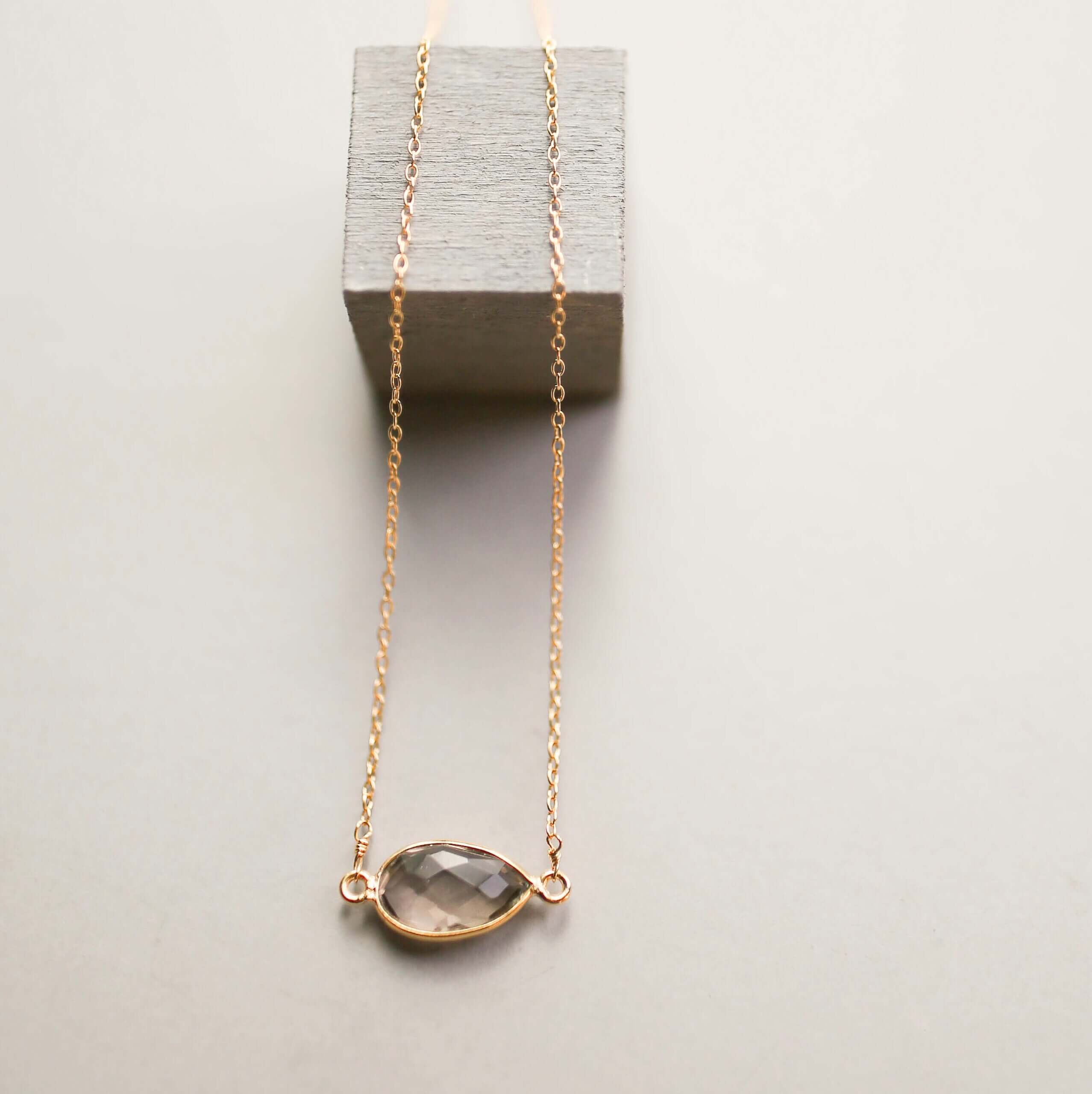 Gold minimalist necklace with a beautiful smoky quartz bezel set stone