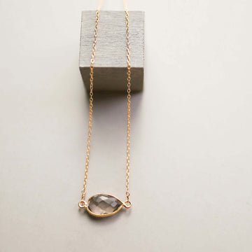 Gold minimalist necklace with a beautiful smoky quartz bezel set stone