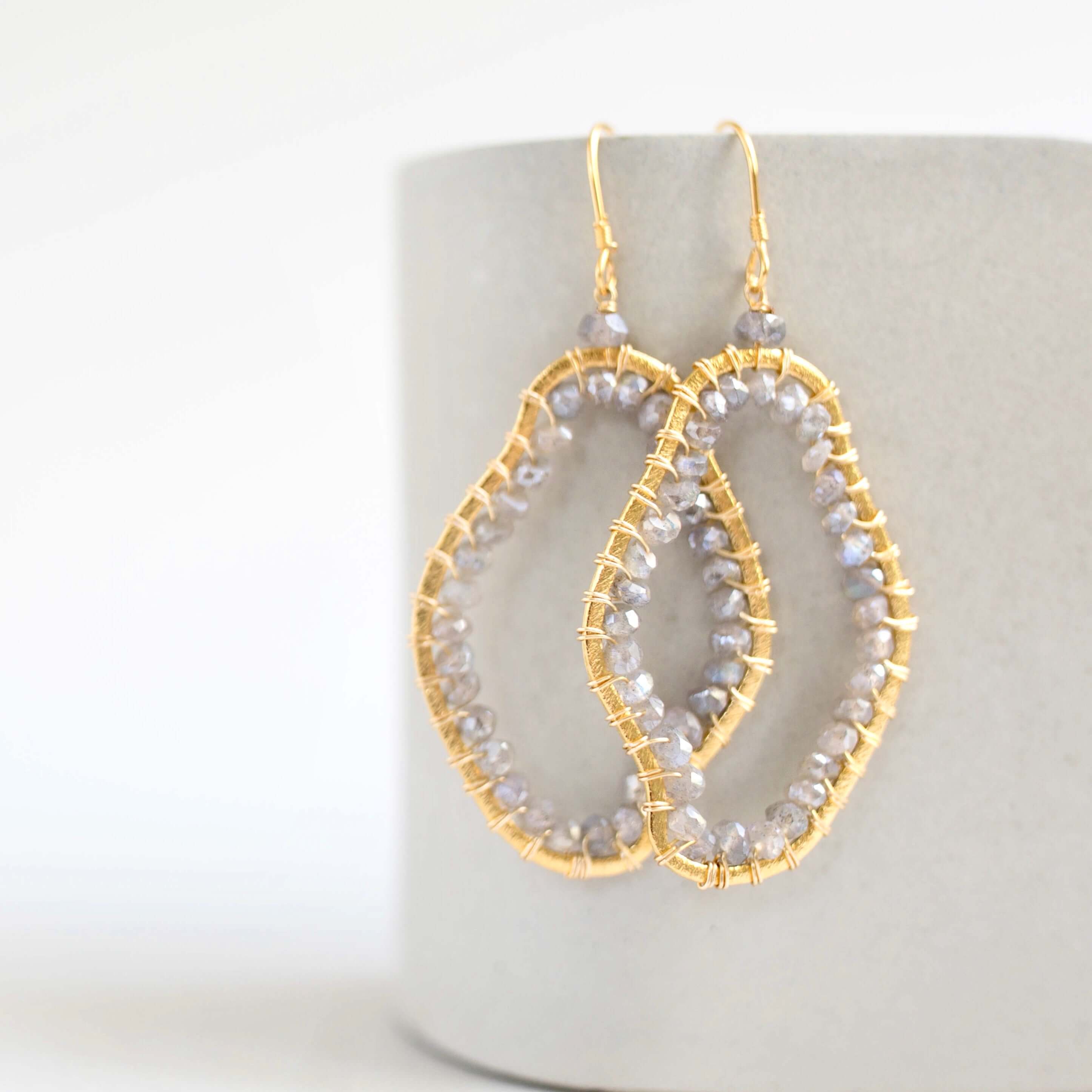 Elegant 2.5" long earrings featuring stunning labradorite gemstones.