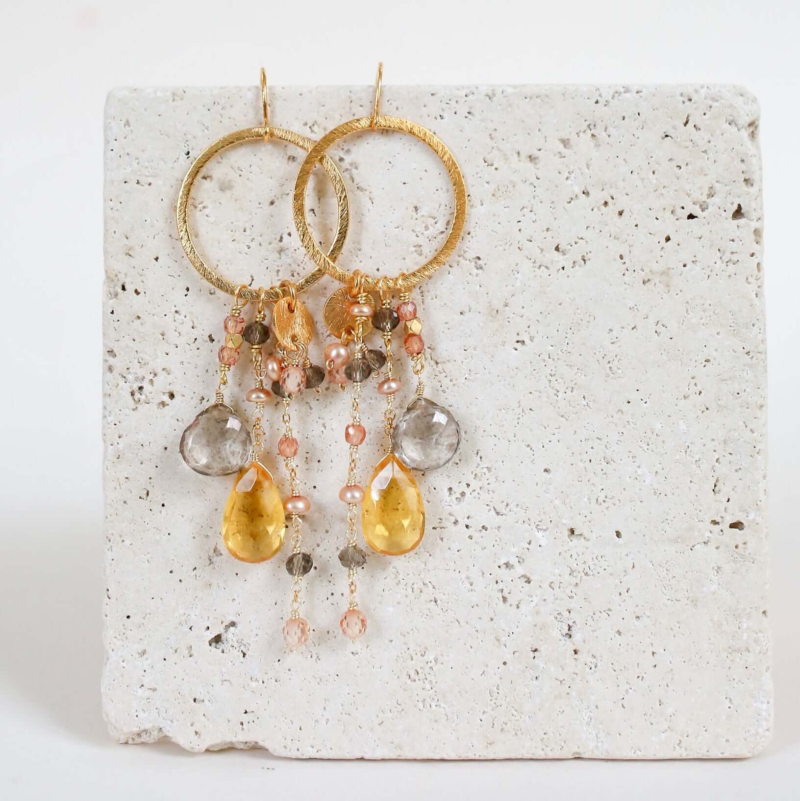 Multiple strands of lush gems sparkle on a hoop with Citrine Gemstone Dangle Gold Earrings