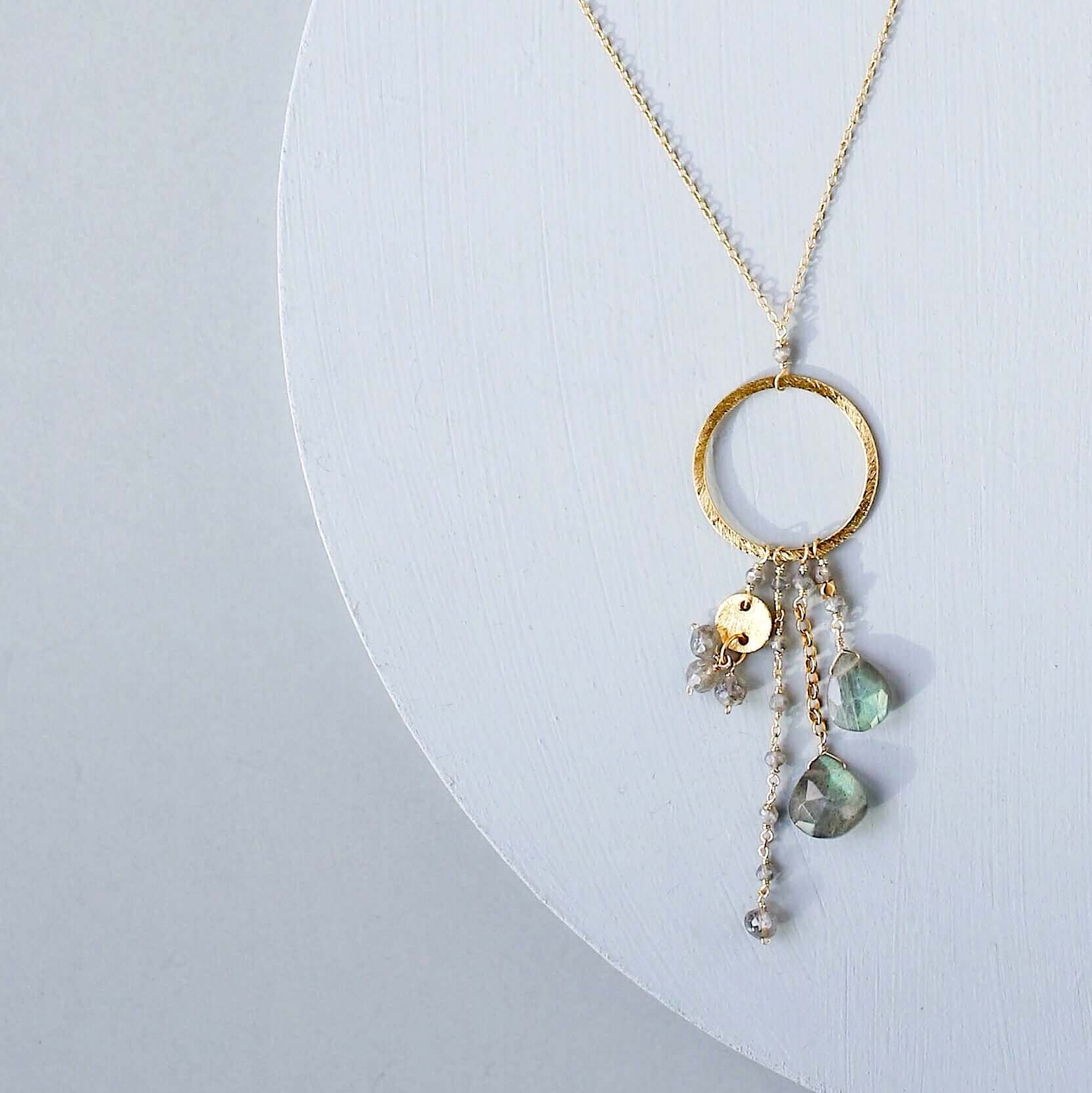 Multiple strands of lush gems sparkle on a hoop with labradorite gemstone Pendant Gold Necklace