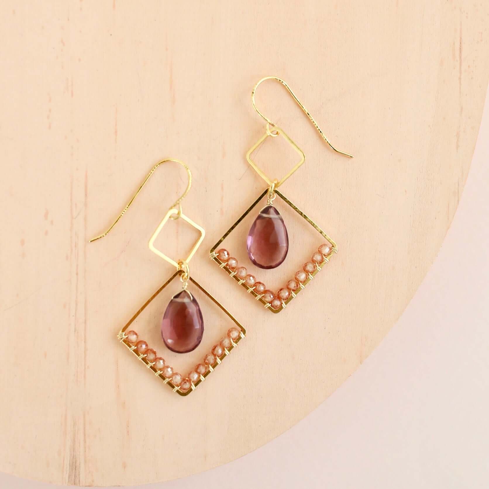 Gold geometric earrings with rhodolite garnet and champagne quartz gemstones