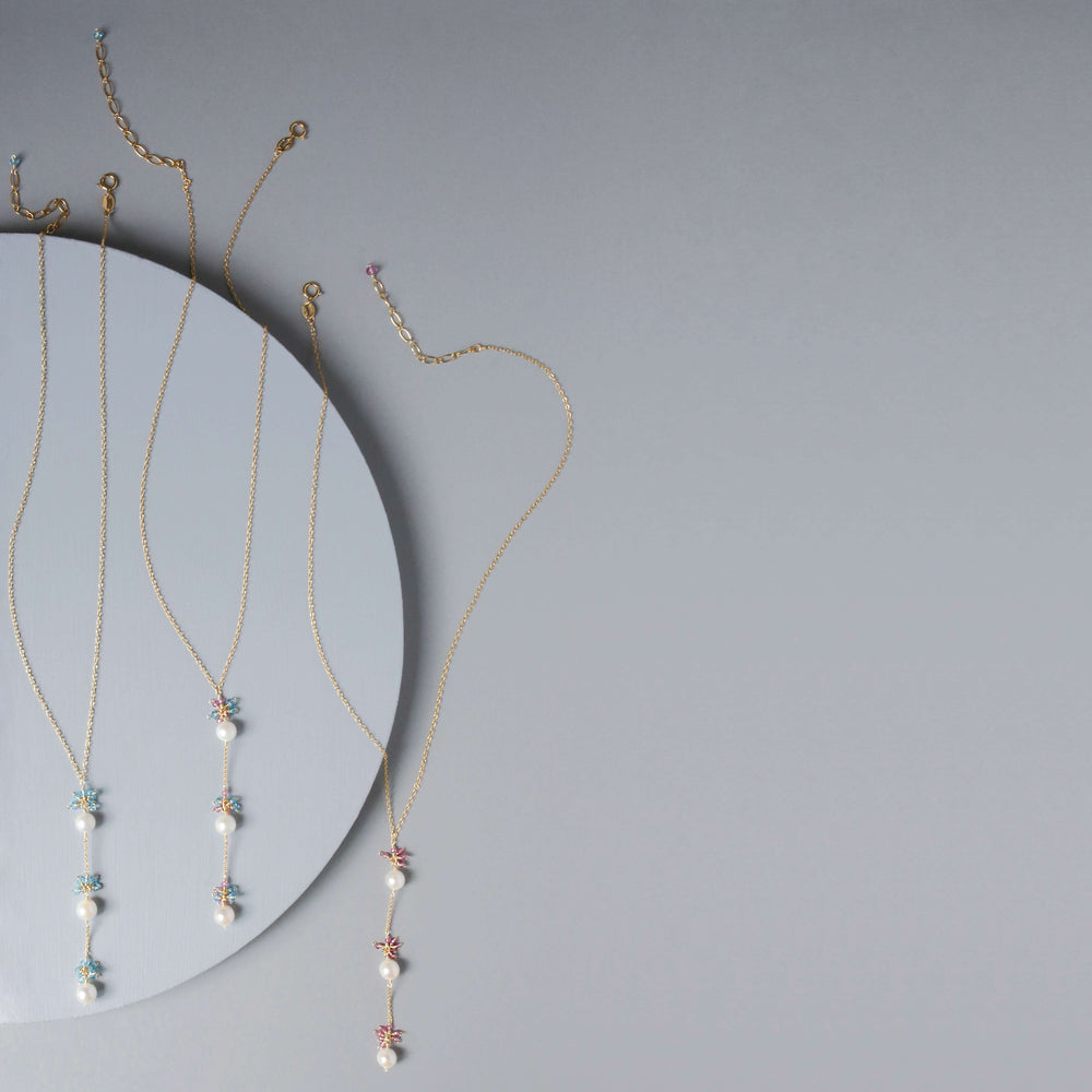 Gold plated Necklace with 3 white freshwater bead pearls paired with genuine aquamarine quartz gemstones