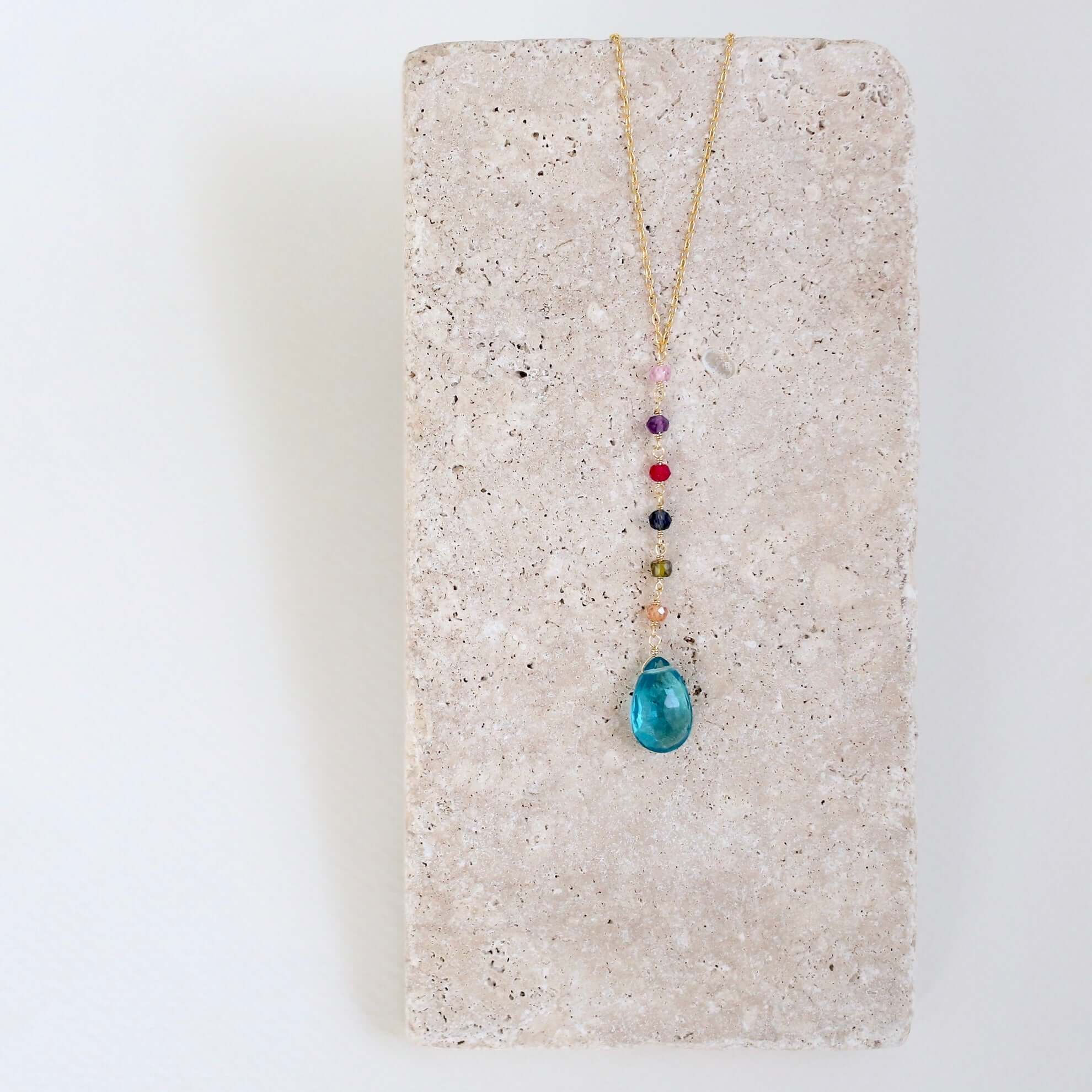 Gold Yoga pendant with neon blue quartz gemstones, multi-color accent stones Necklace