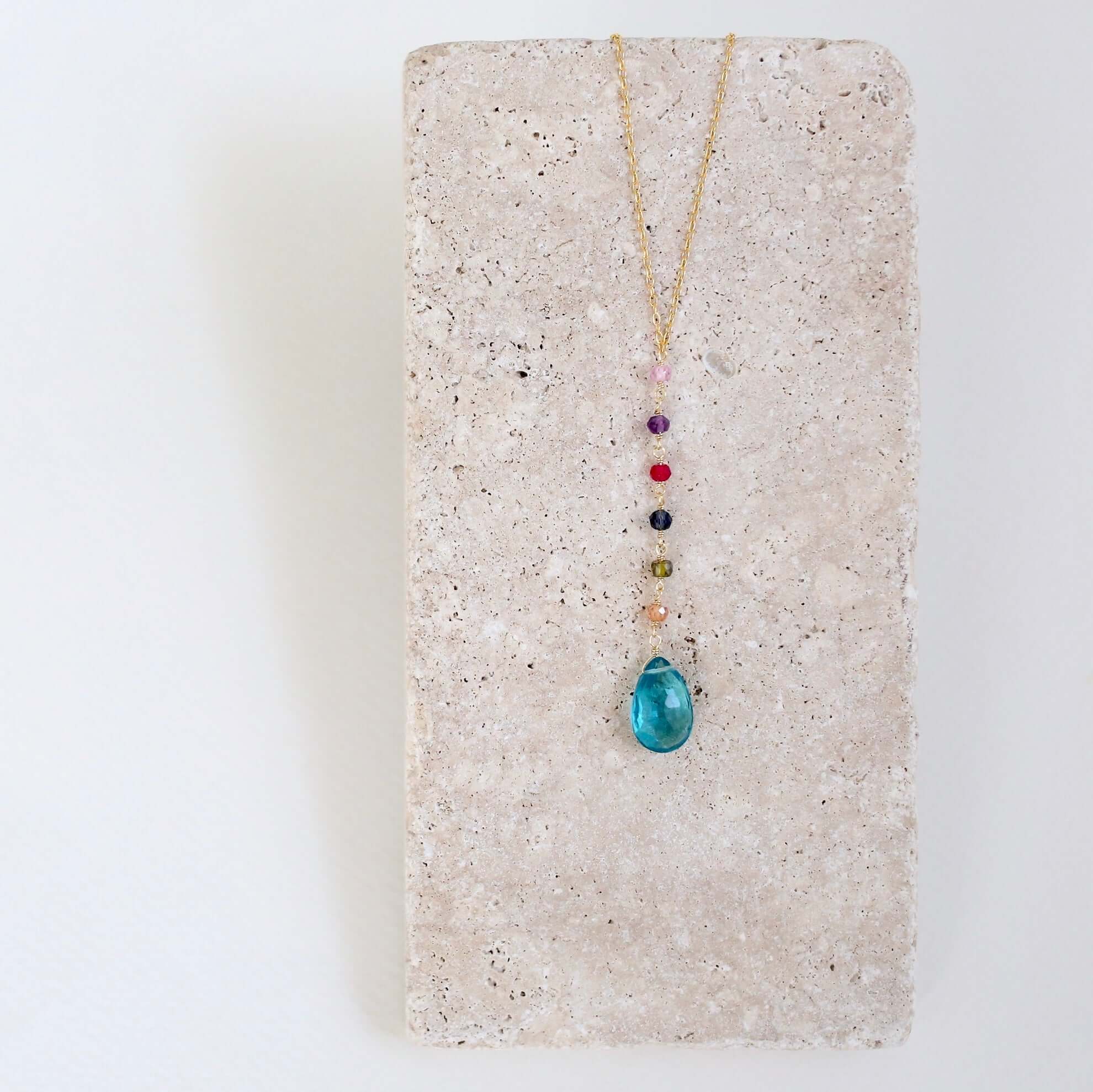 Gold Yoga pendant with neon blue quartz gemstones, multi-color accent stones Necklace