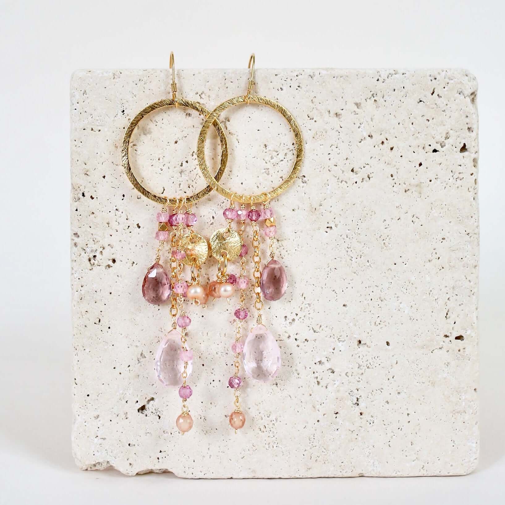 Multiple strands of lush gems sparkle on a hoop with Pink Gemstone Dangle Gold Earrings