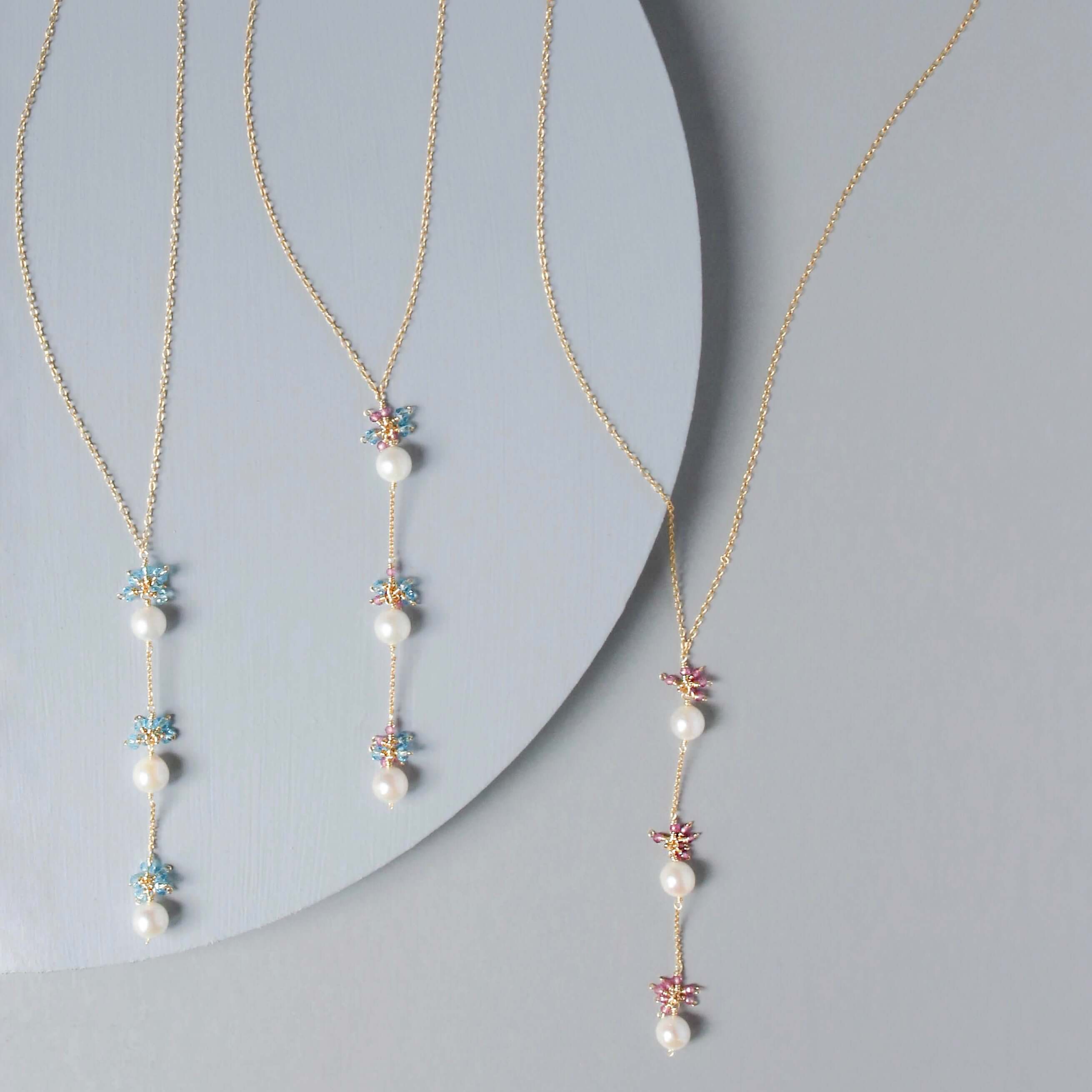 Colorful Gold plated Necklace with 3 white freshwater bead pearls paired with genuine rose quartz and aquamarine quartz gemstones
