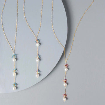 Colorful Gold plated Necklace with 3 white freshwater bead pearls paired with genuine rose quartz and aquamarine quartz gemstones