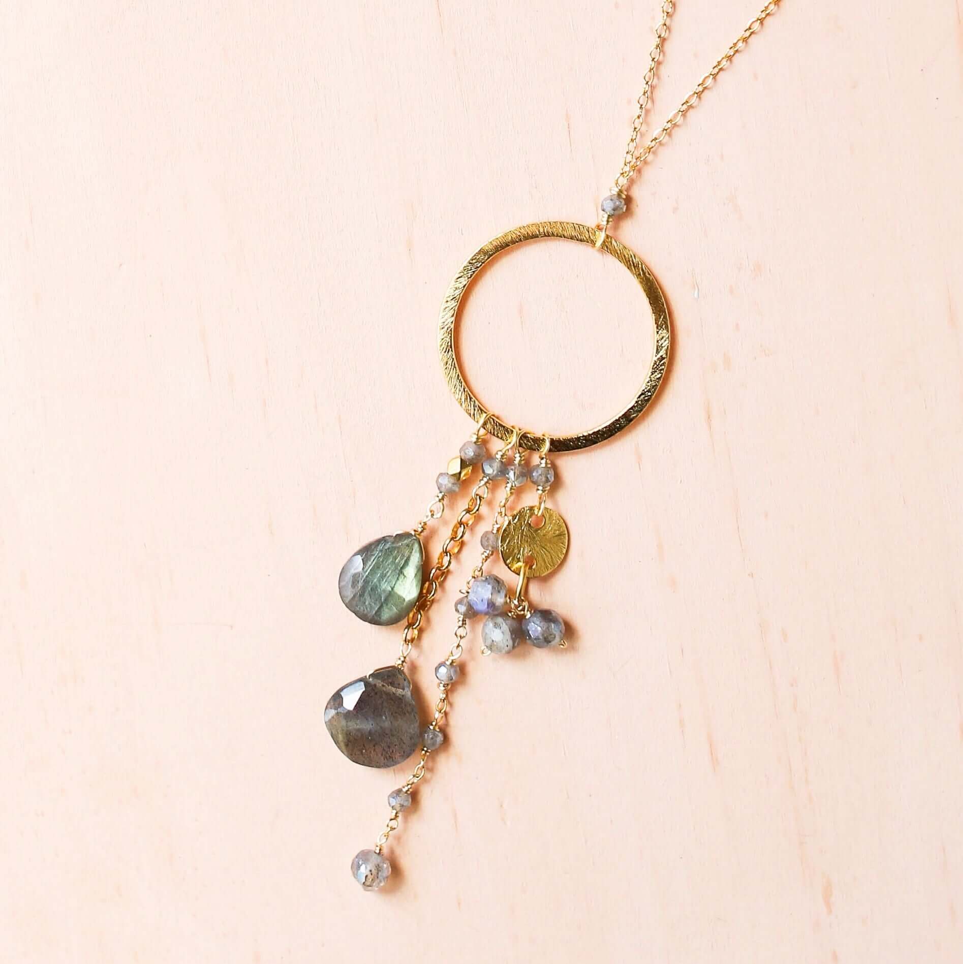 Multiple strands of lush gems sparkle on a hoop with labradorite gemstone Pendant Gold Necklace