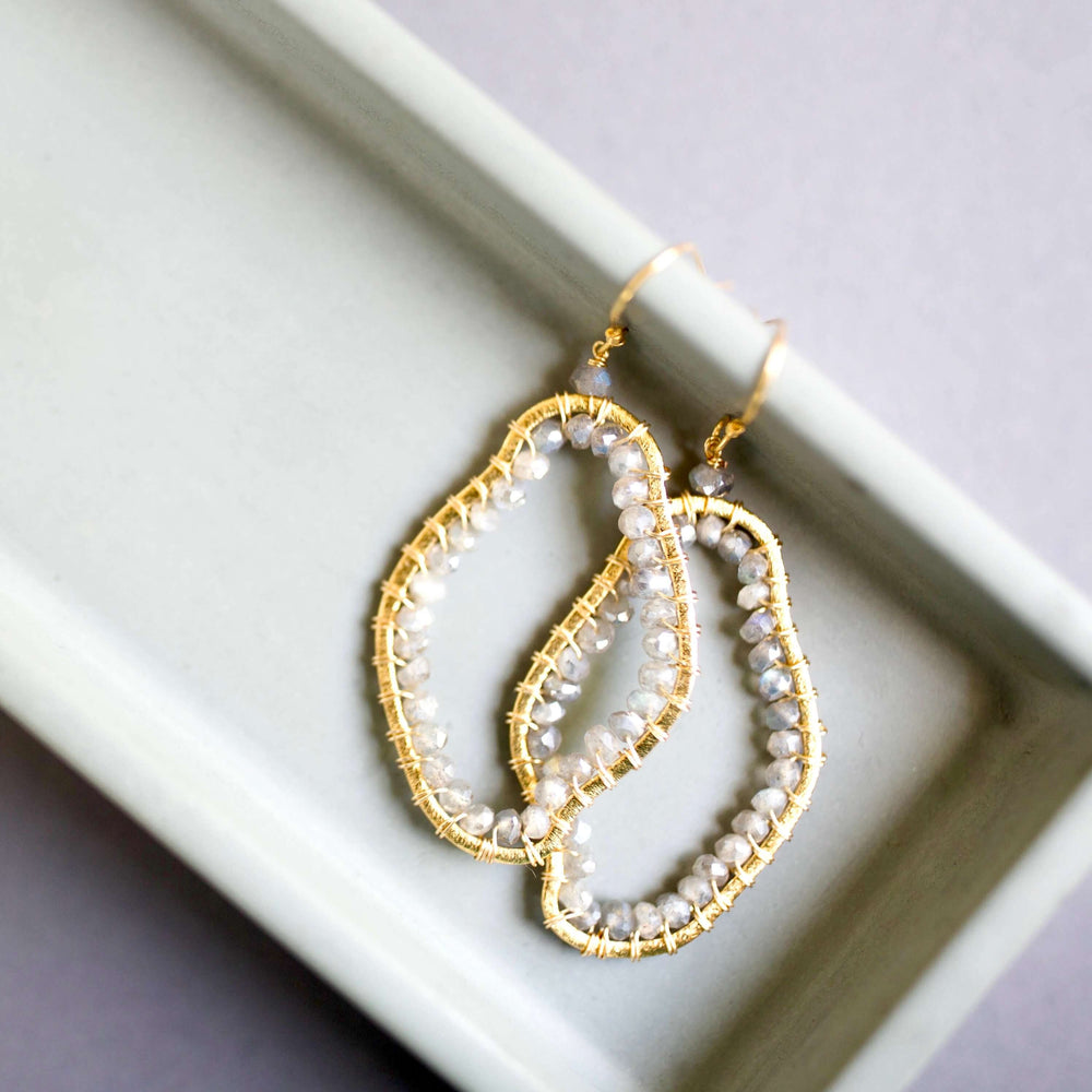 Elegant 2.5" long earrings featuring stunning labradorite gemstones.