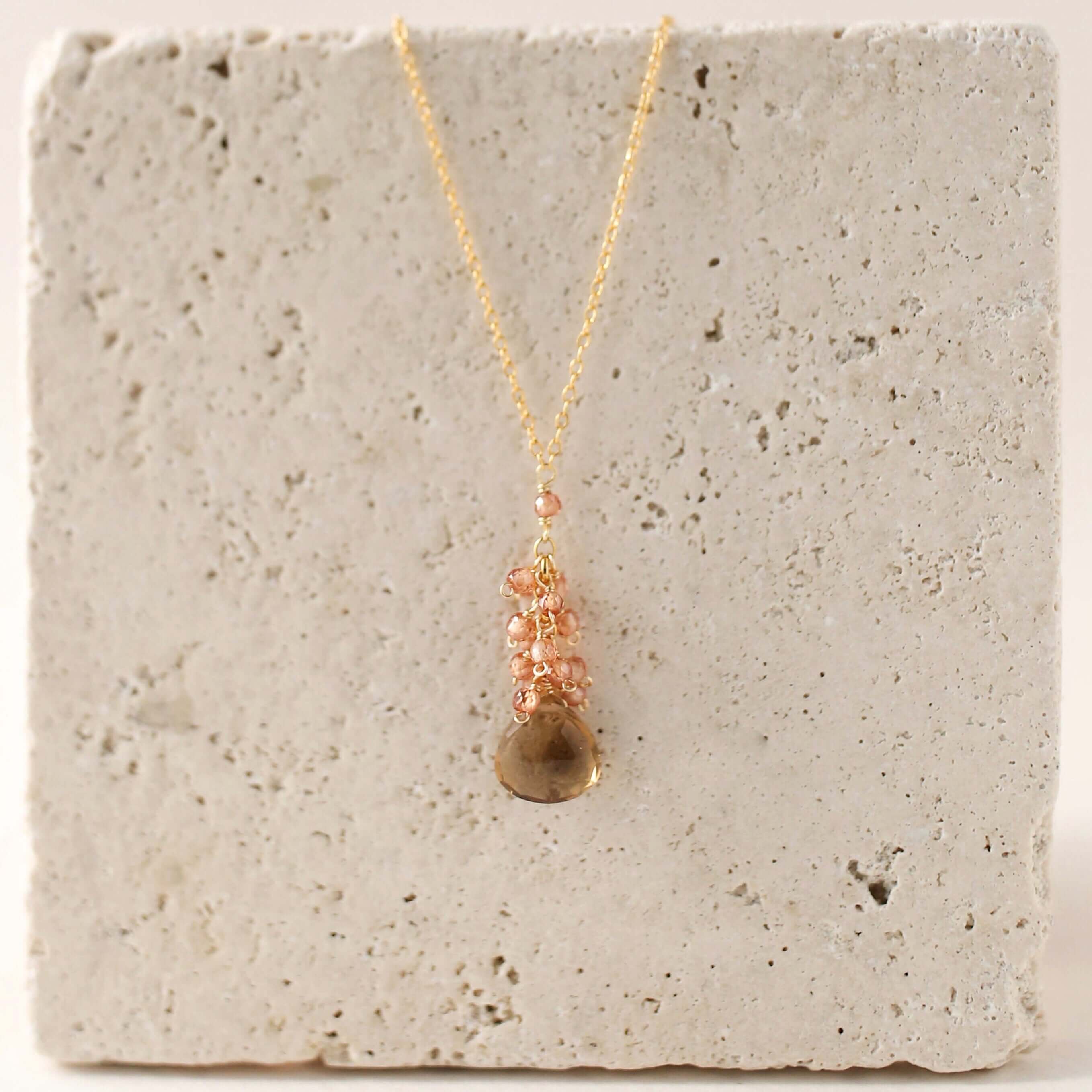 Smoky quartz "raindrop" pendants paired with a cluster of mini champagne quartz gems Gold Necklace