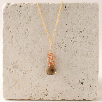 Smoky quartz "raindrop" pendants paired with a cluster of mini champagne quartz gems Gold Necklace