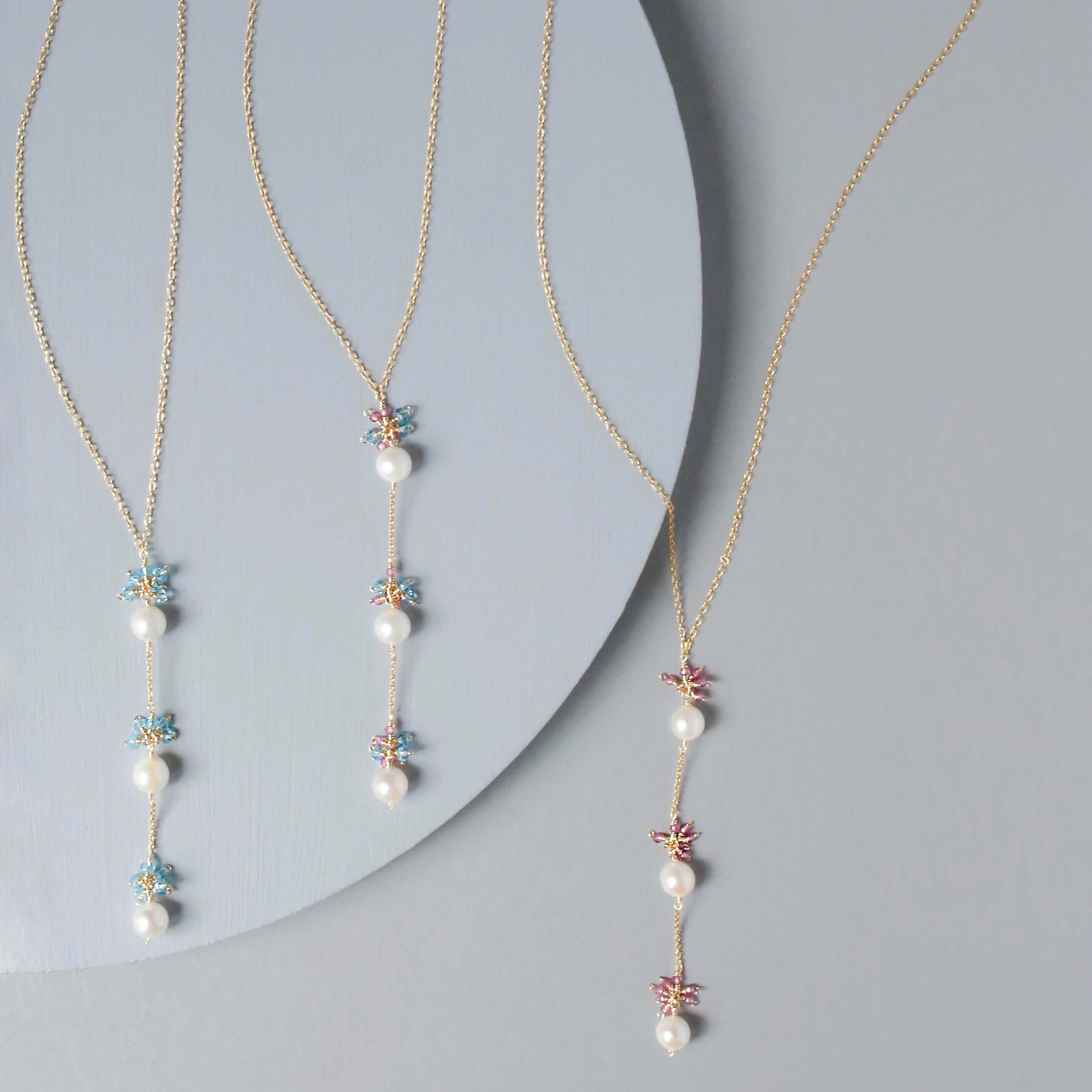 Colorful Gold plated Necklace with 3 white freshwater bead pearls paired with genuine Pink Tourmaline quartz and aquamarine quartz gemstones