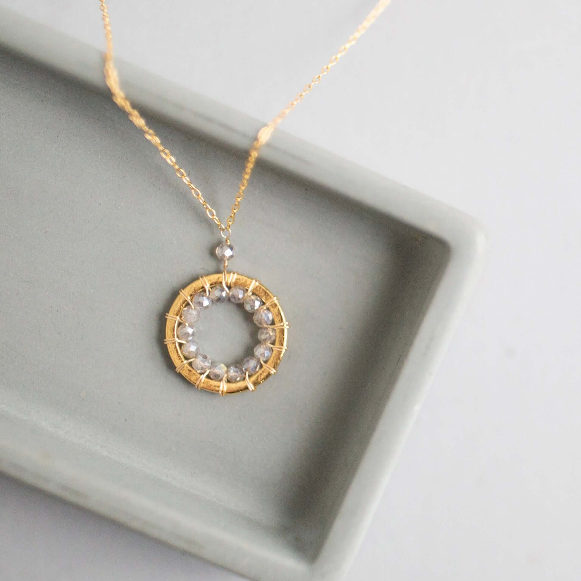 Mini Gold Circle Necklace with Unique Labradorite Gemstones Detail.